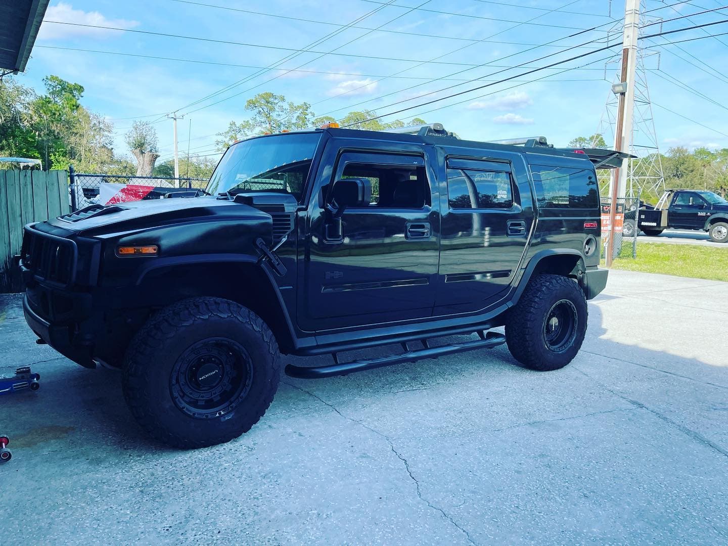 Black Hummer H2 fitted with new tires at 4Ever Tires