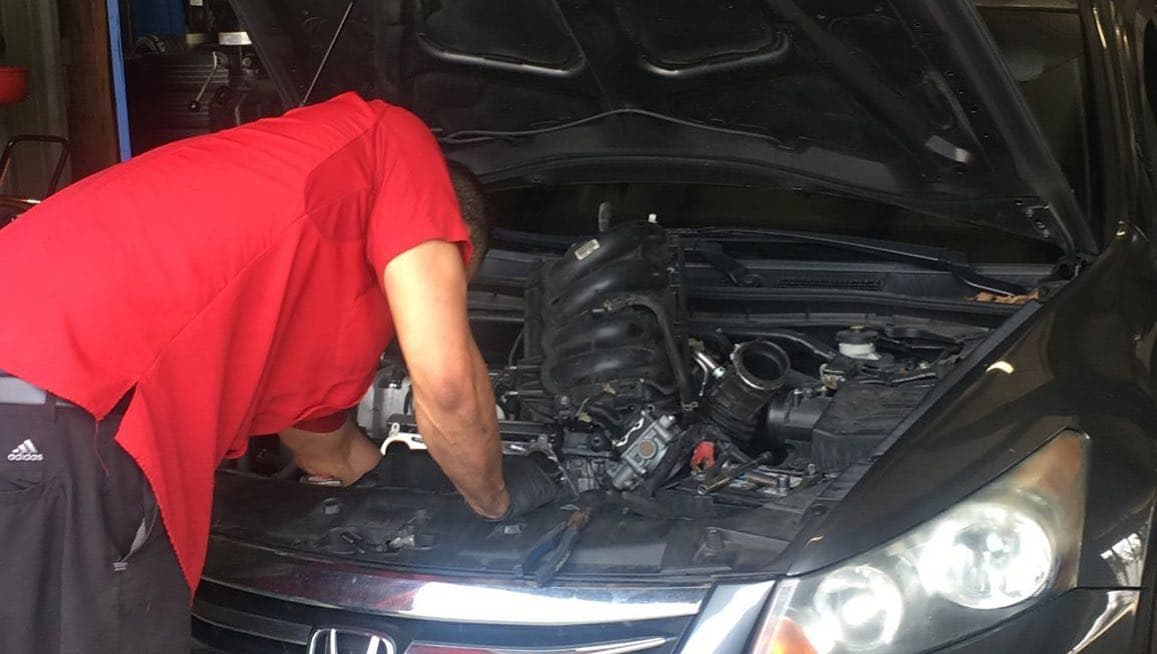 4Ever Tires technician performing engine service on Honda Accord